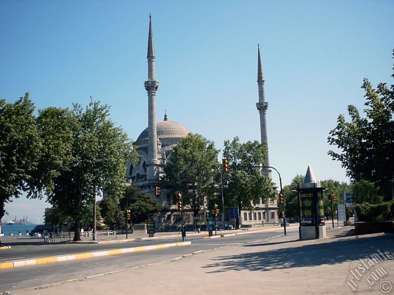 View of Dolmabahce coast and Valide Sultan Mosque in Dolmabahce district in Istanbul city of Turkey.
