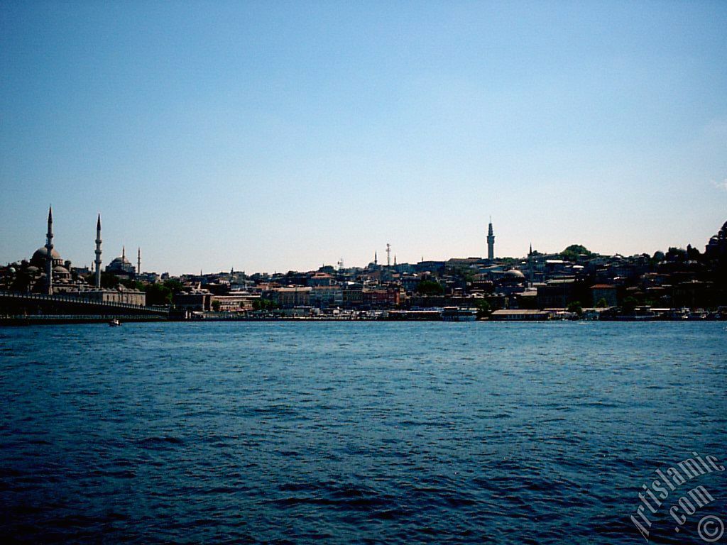 View of Eminonu coast, (from left) Galata Bridge, Yeni Cami (Mosque), Sultan Ahmet Mosque (Blue Mosque), (below) Egyptian Bazaar (Spice Market) and Beyazit Tower from the shore of Karakoy-Persembe Pazari in Istanbul city of Turkey.
